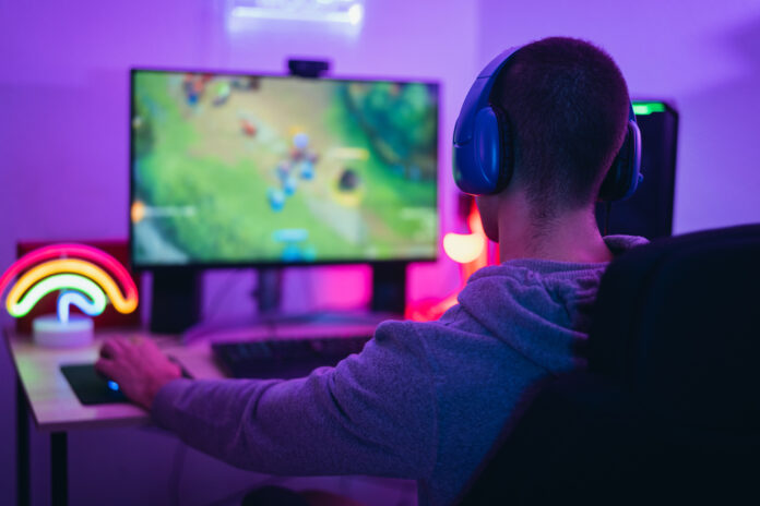 Young,Gamer,Playing,Online,Video,Games,While,Streaming,On,Social